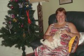 Kerrie and Lucy seated near teh Christmas tree
